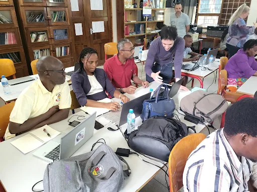 AHUMAIN project participants working together at laptops