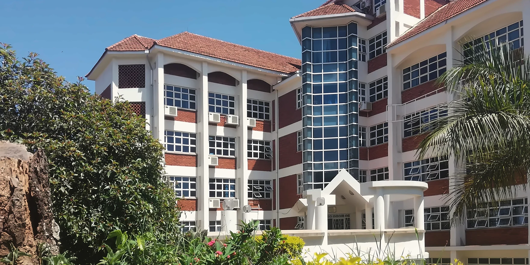 The College of Computing and Information Sciences building at Makerere University, framed by gardens
