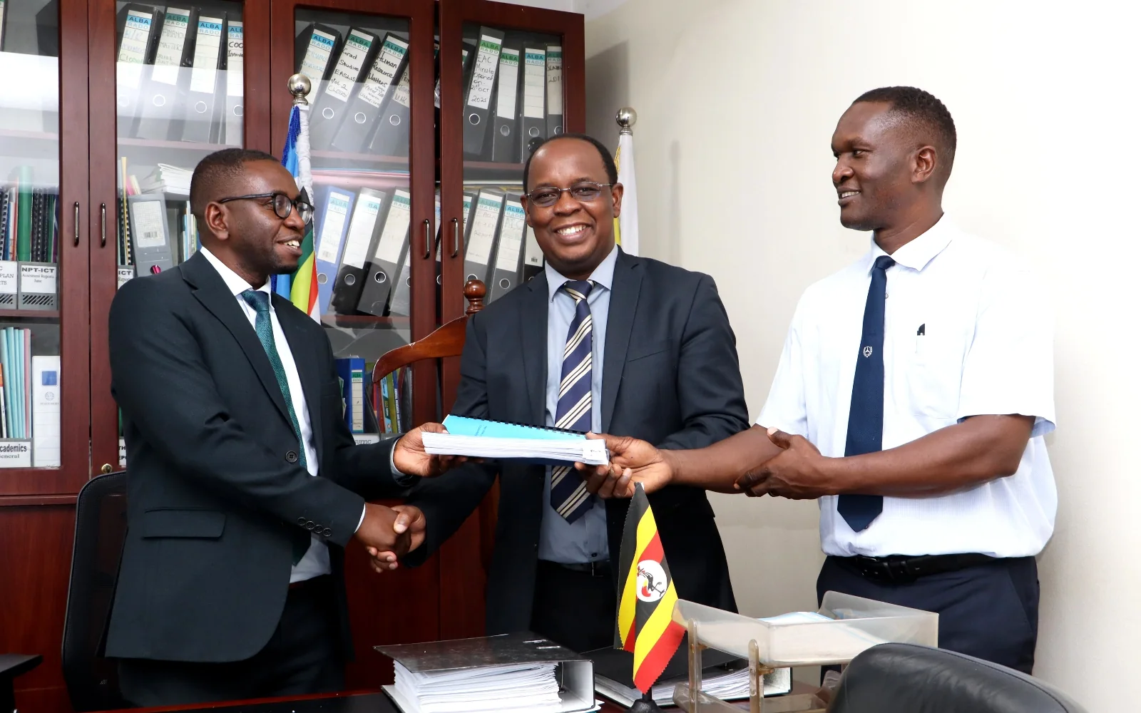Dr. Peter Nabende handing over the CoCIS Principal’s office to Prof. Engineer Bainomugisha